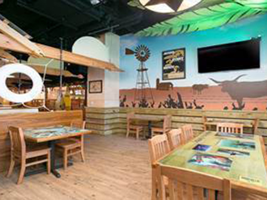 Alamo RM Interior with wooden chairs and tables